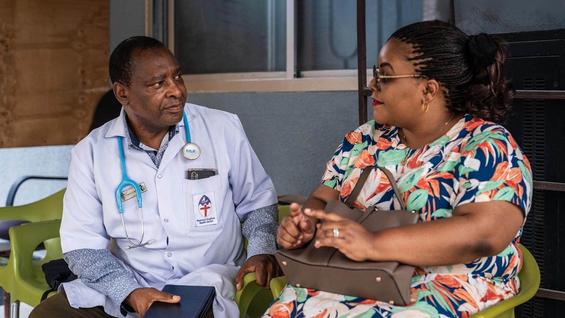 Dr. Yohana Mokiwa chatting with a patient, Dar es Salaam, Tanzania