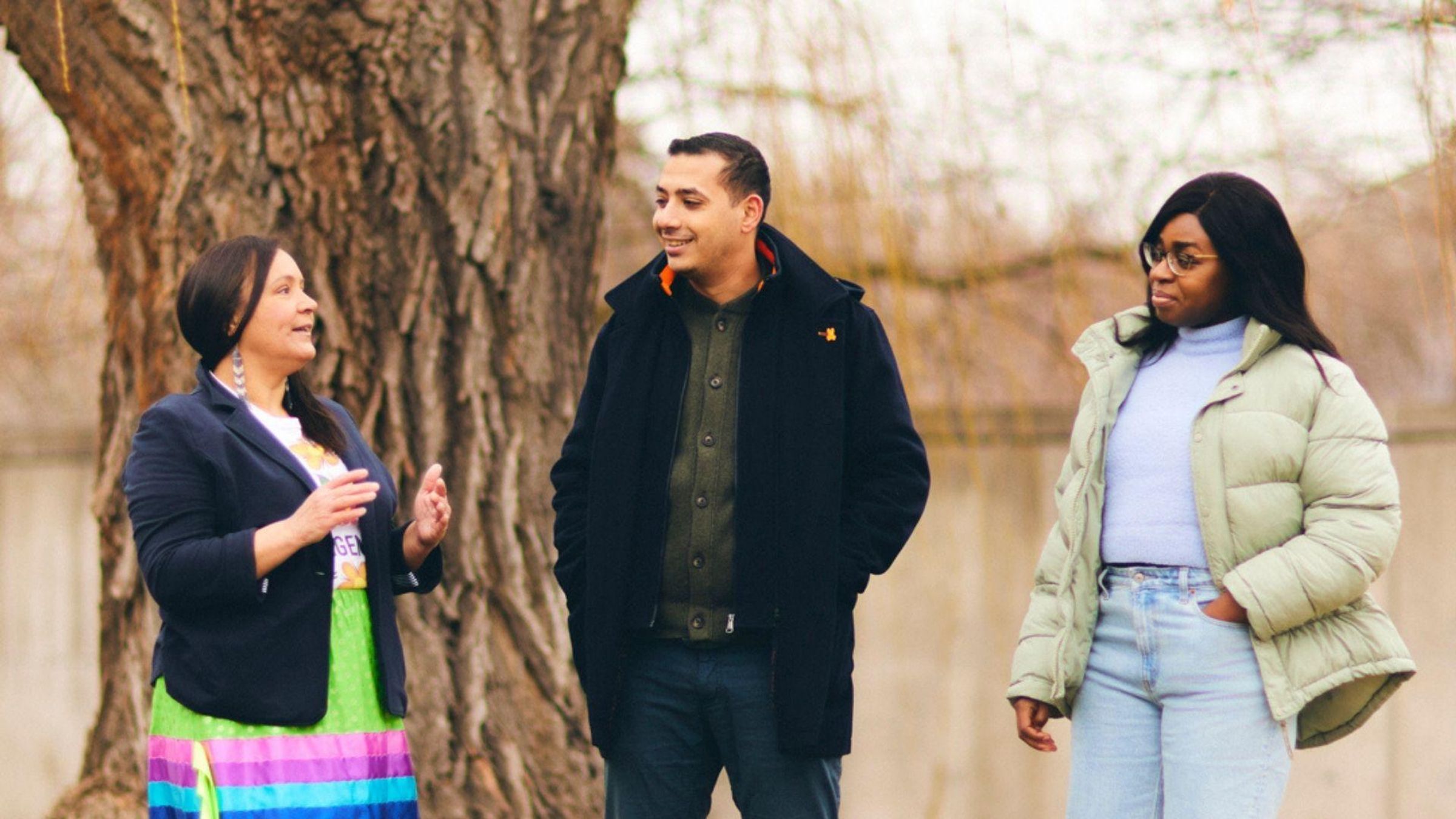 Three Sanofians talking outside