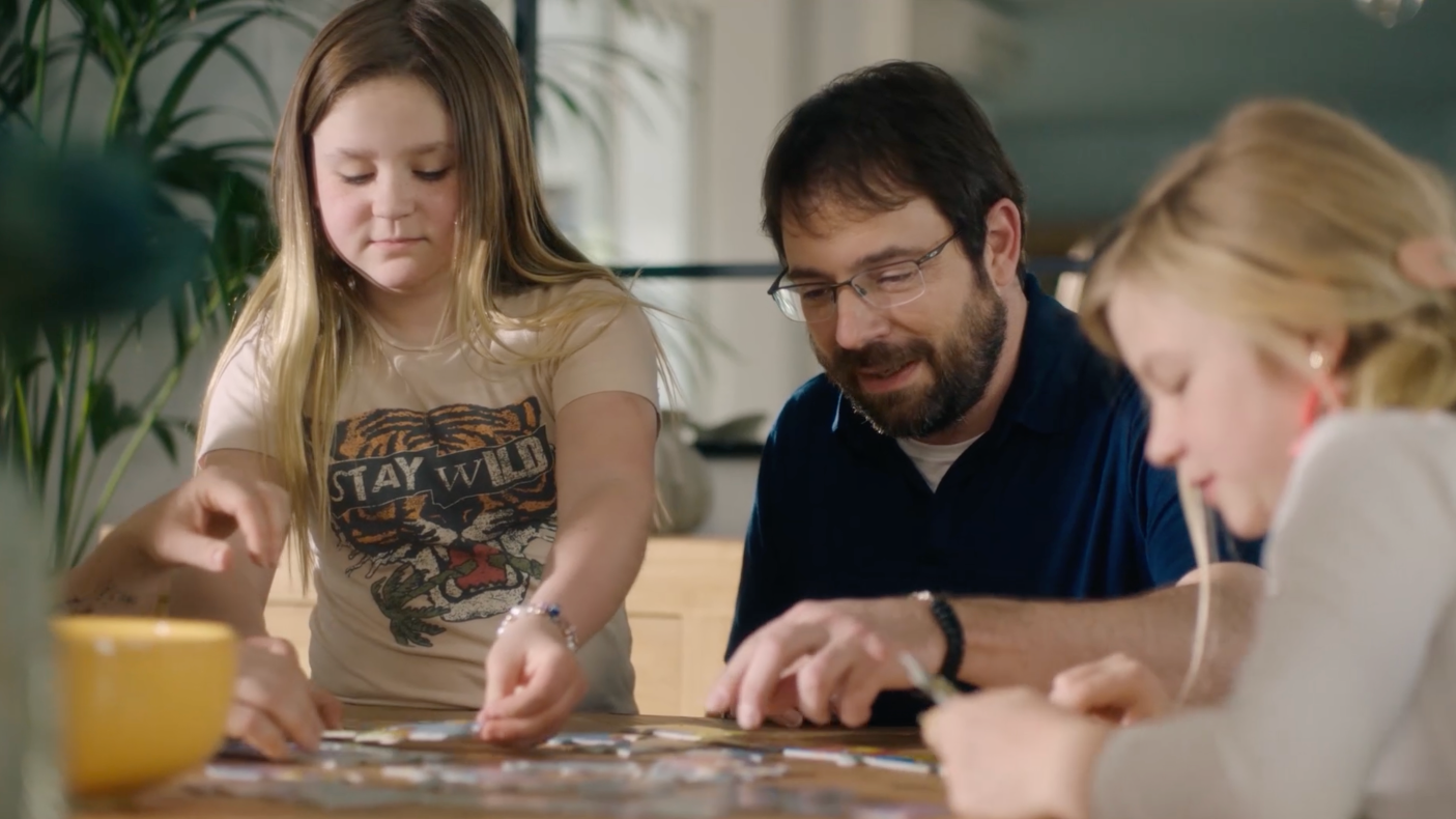 Mark, who lives with severe hemophilia A, with his two young daughters.