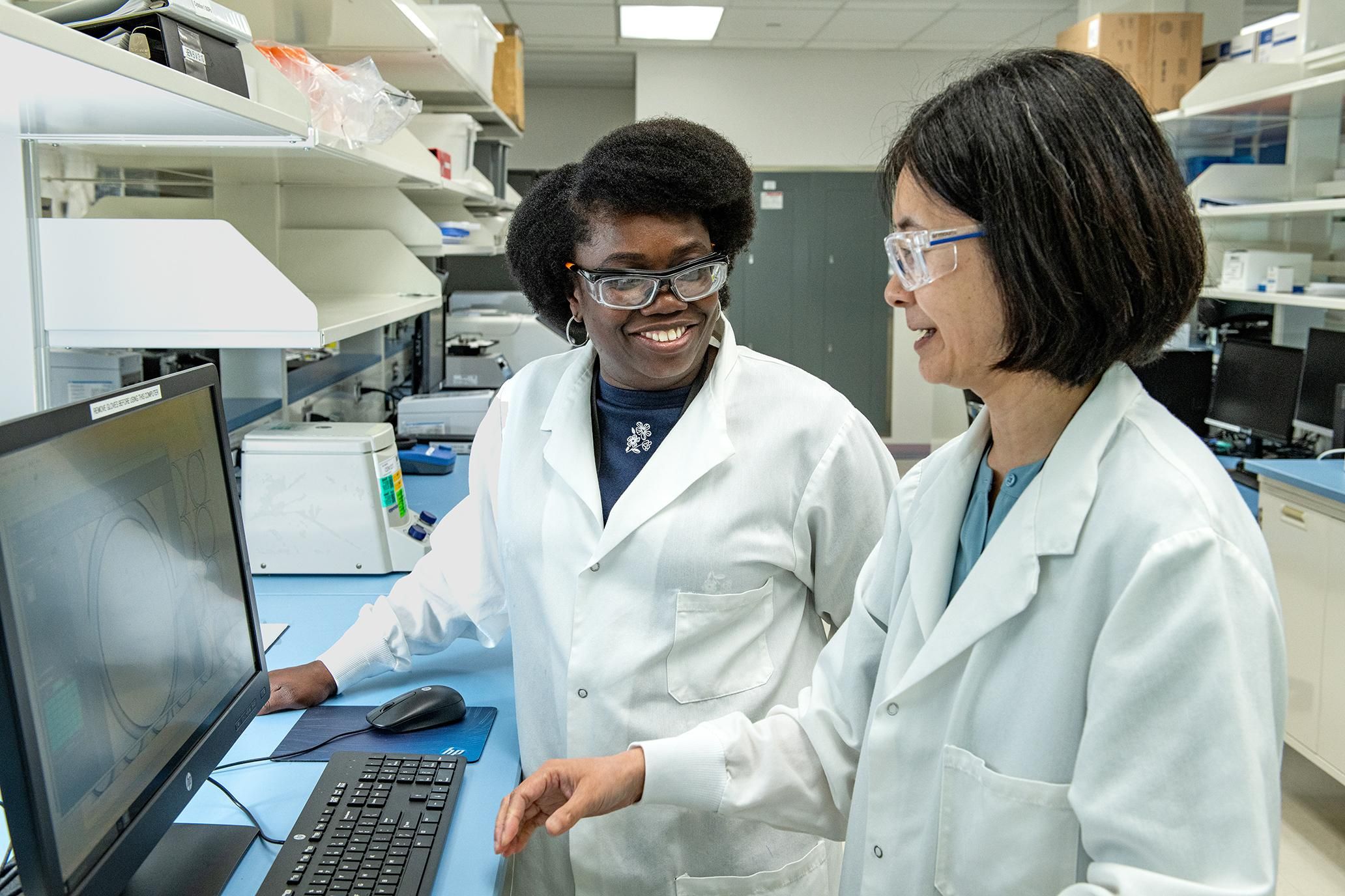 L-R Francisca Aidoo-Nyarko, Technologist, and Ju Huang, Senior Scientist, Toronto, Canada